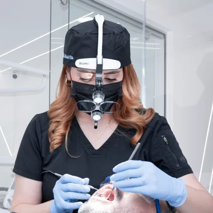 Dr. Michelle Villa at her desk in a dental clinic.