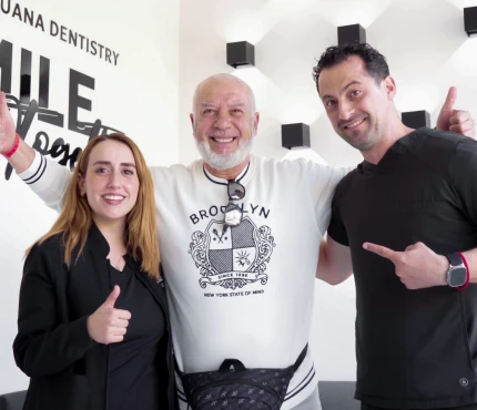 happy patient with new smile made by dentist in Tijuana