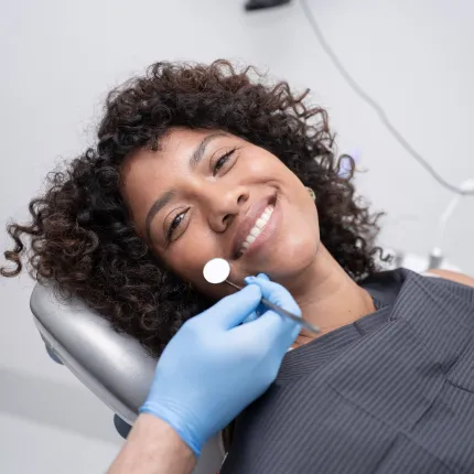 A happy patient showing a bright smile after receiving dental treatment in Tijuana.