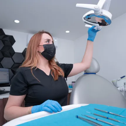 Dental specialist evaluating a patient's teeth at Smile Together Tijuana before starting the whitening process