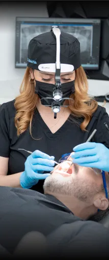 Step 4 of the veneer process in Tijuana: bonding the veneers to the patient’s teeth for a permanent result.